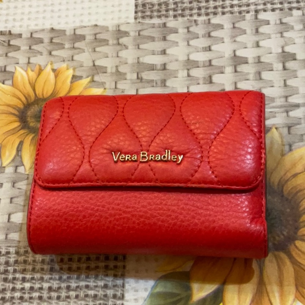 Vera Bradley red wallet with floral lining, good condition.